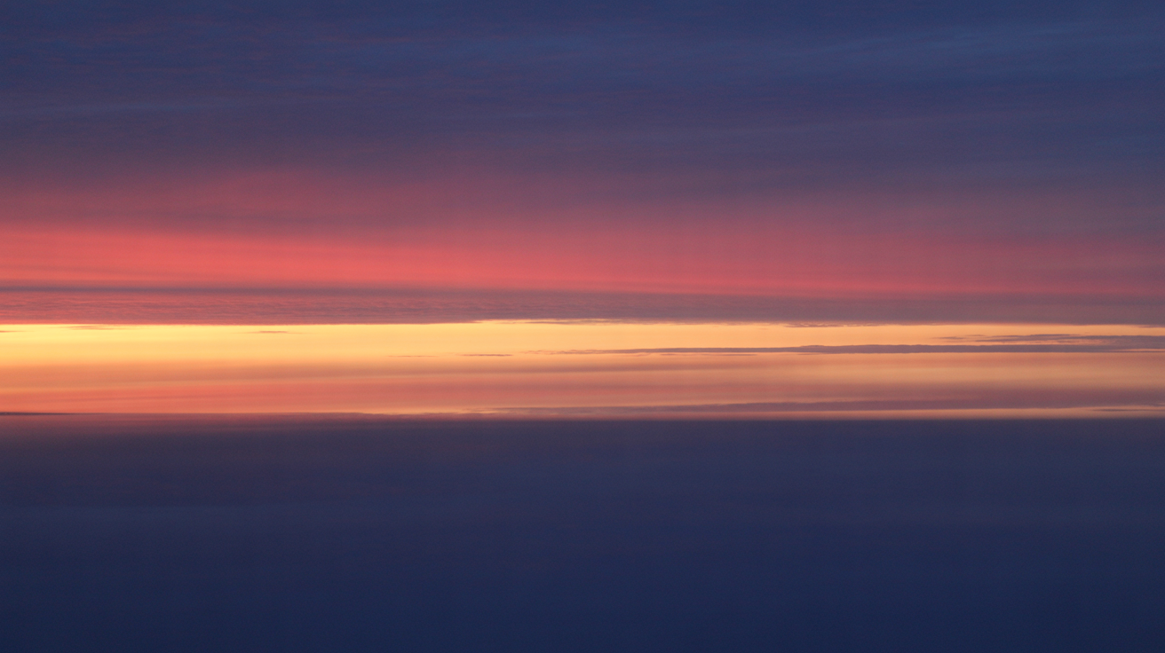 Sunrise over horizon representing hope and transformation