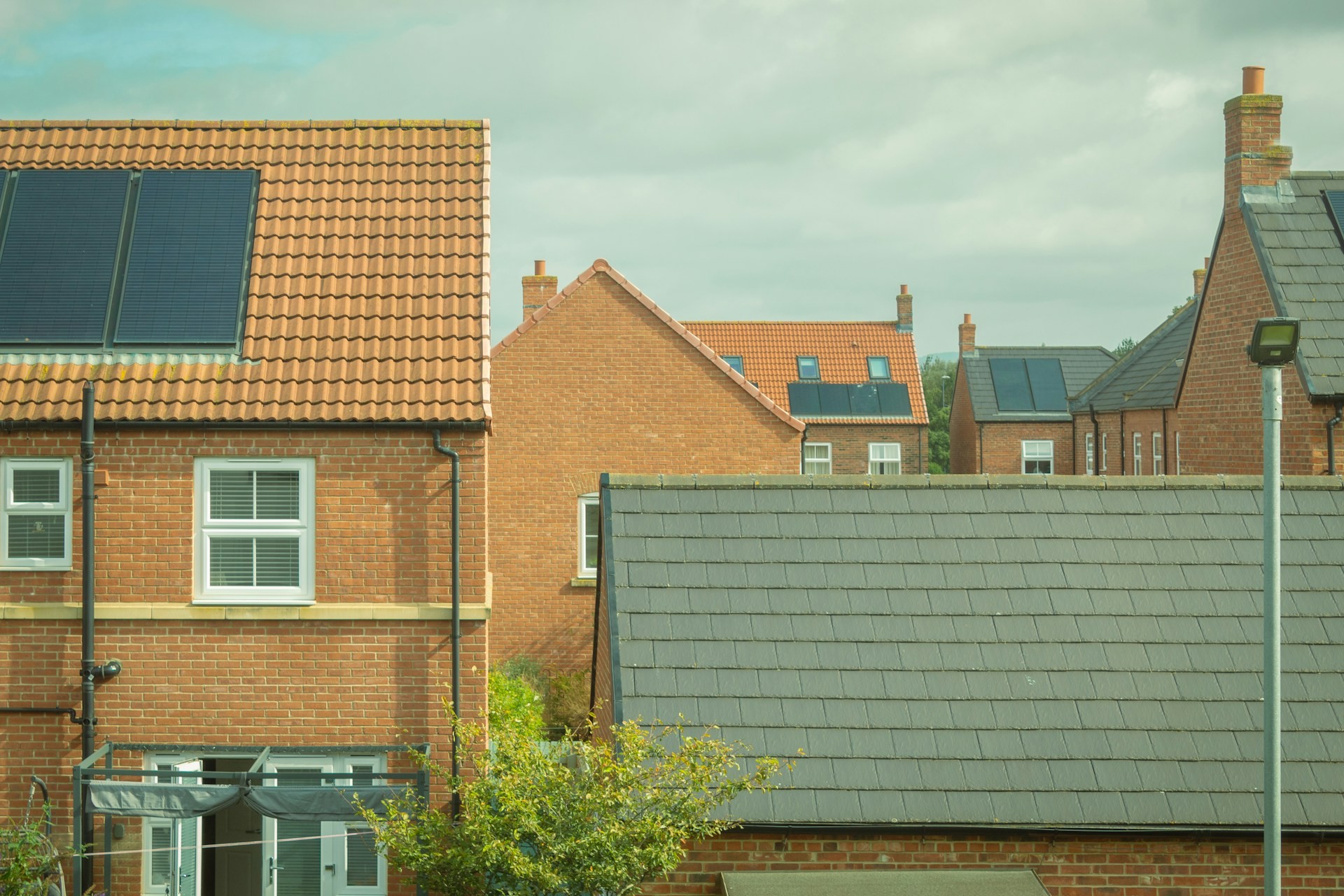 Brick homes with neat fascias and tiled roofs