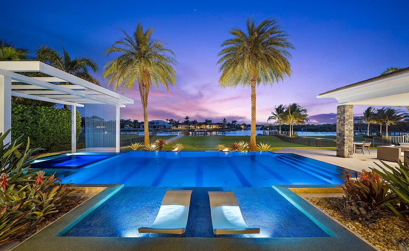 Waterfront property at dusk representing market opportunities