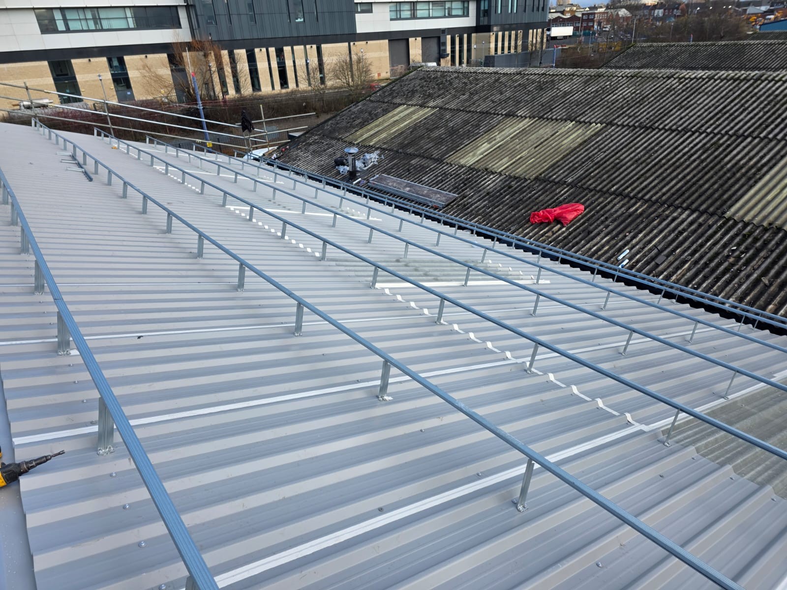 Metal roof cladding on commercial building
