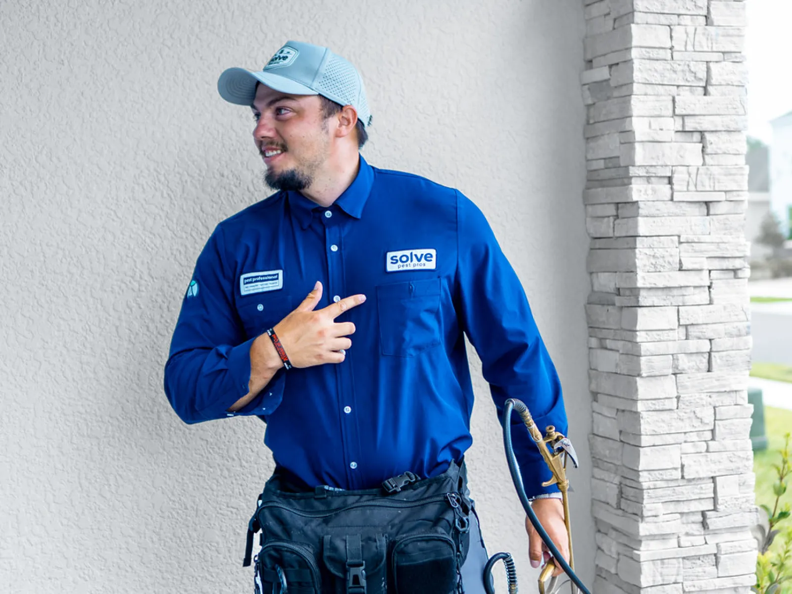 Professional PestGuard Pro technician inspecting a home for pest issues