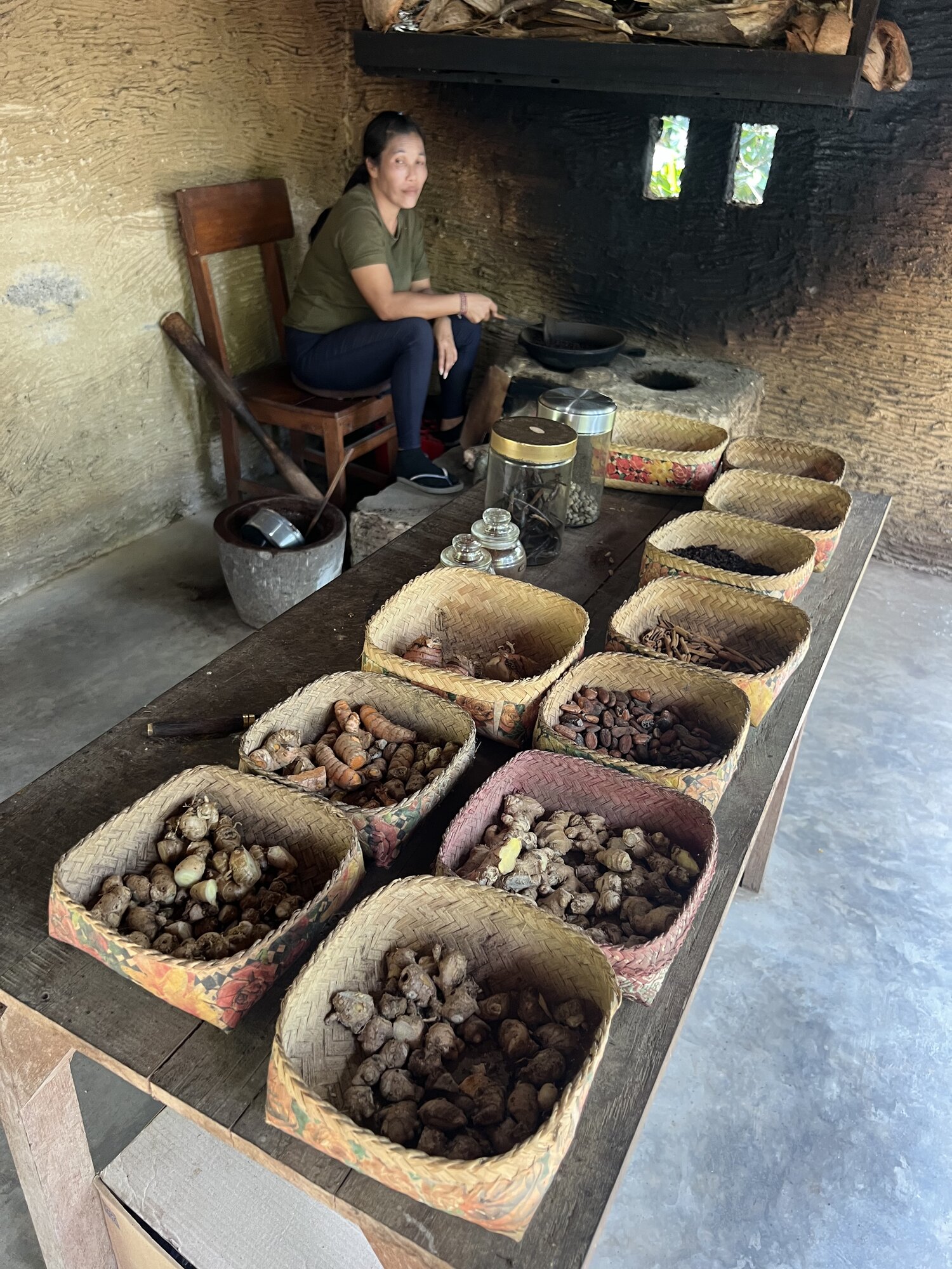 Traditional Balinese coffee and spice plantation — baskets of freshly harvested coffee beans, cacao, cloves, and vanilla at the Luwak Coffee stop on the Green Escape tour