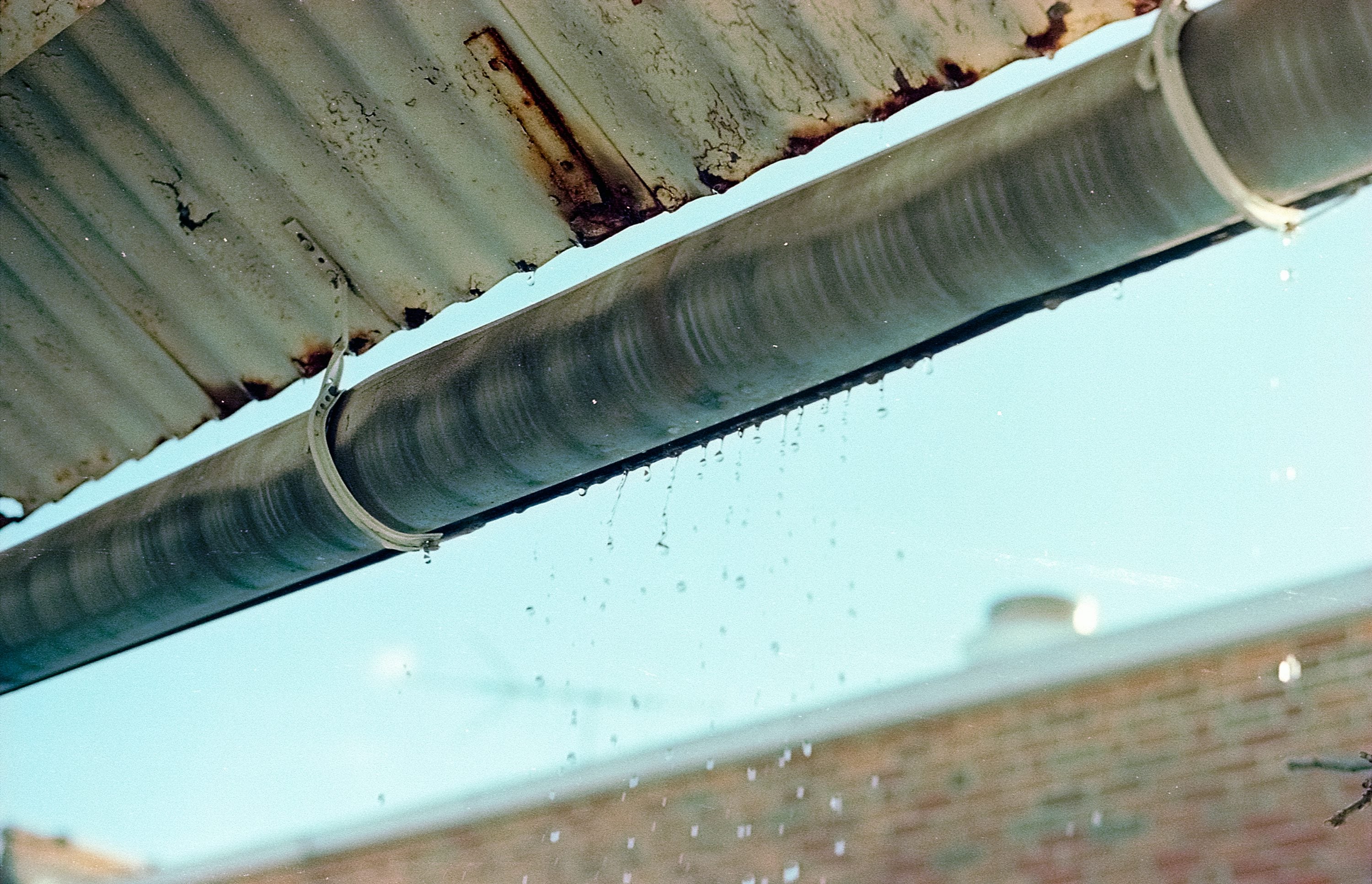 Gutter and downpipe on a brick house