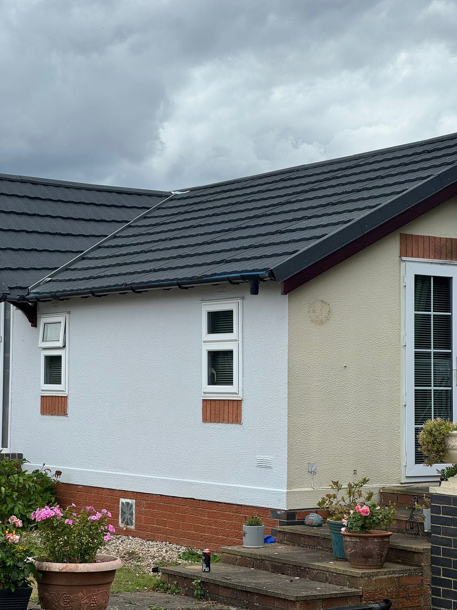 Park home with brand new dark tile roof and freshly rendered walls