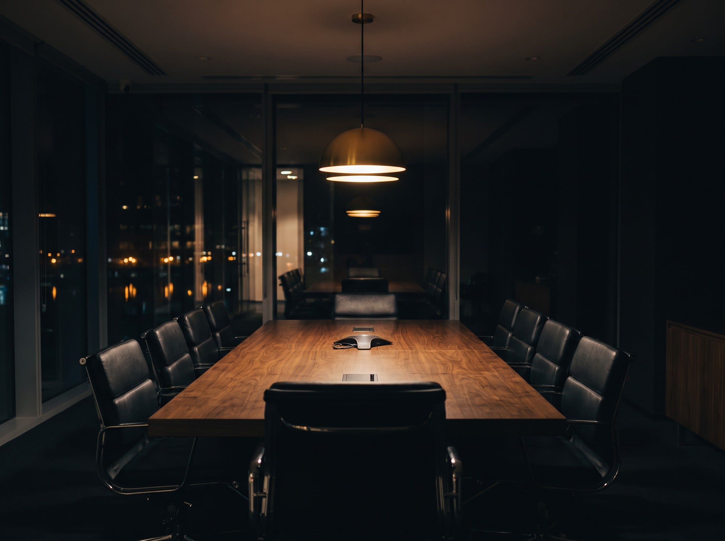 Executive boardroom at night with warm accent lighting