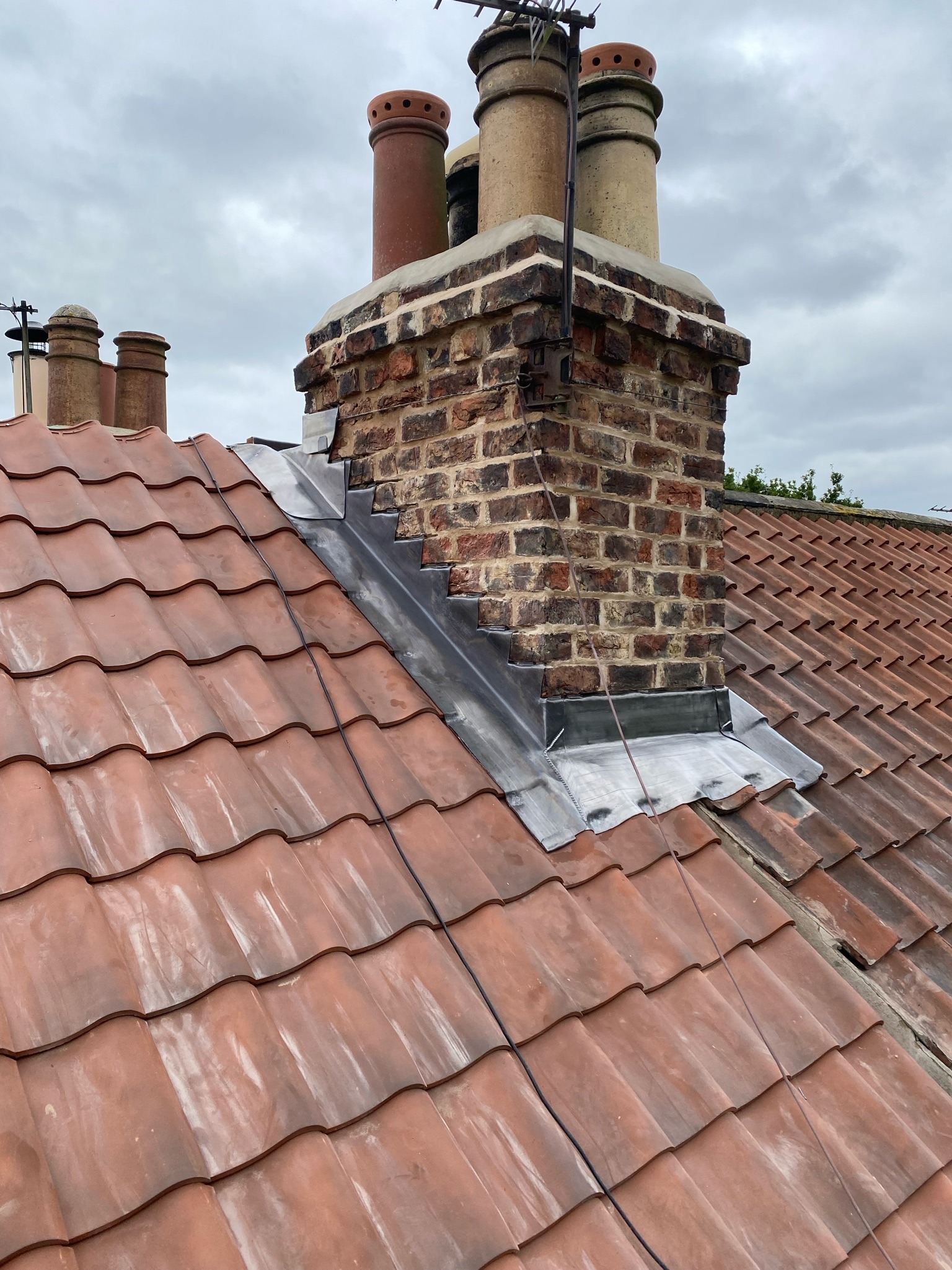 Lead flashing around chimney base