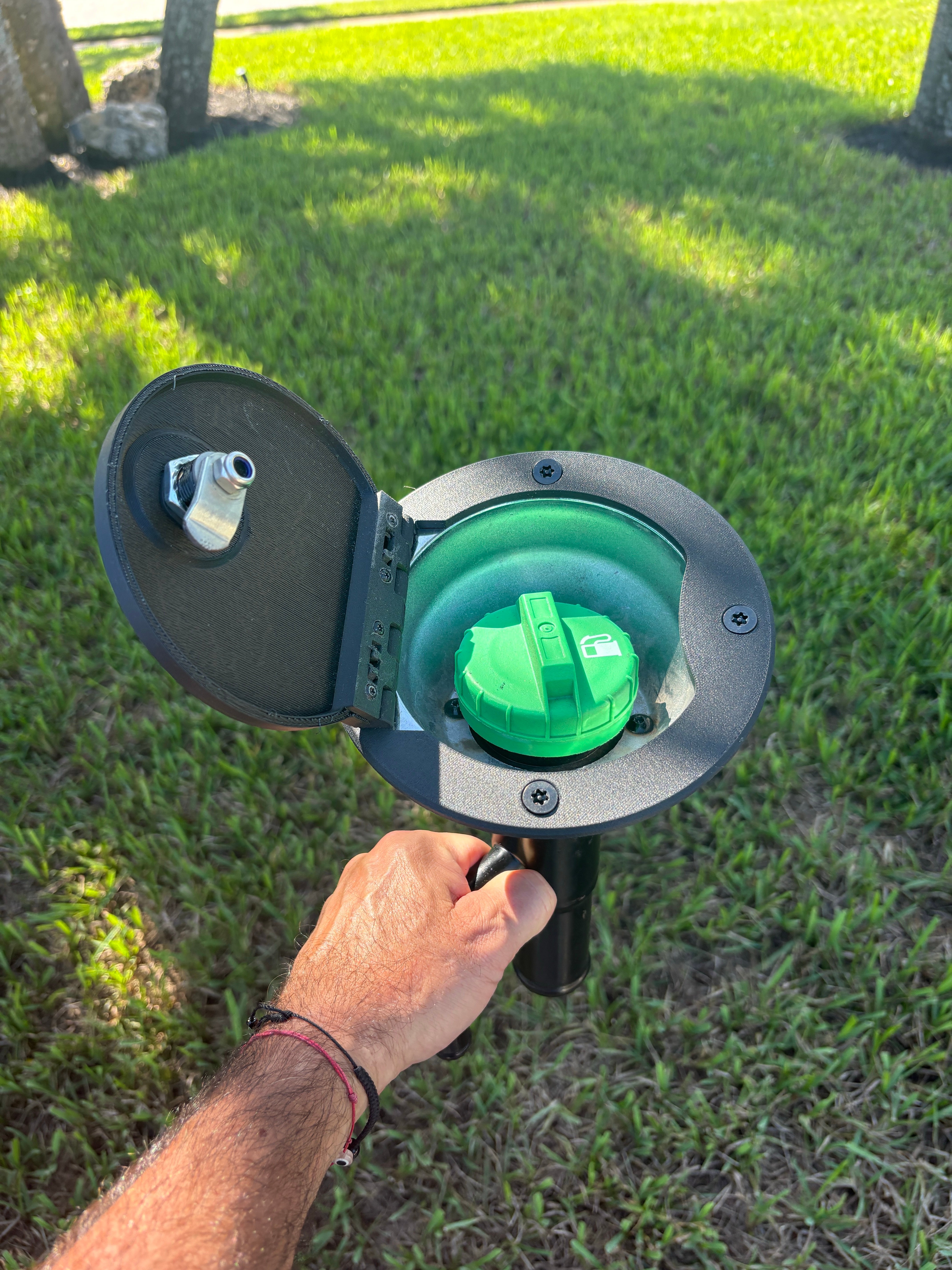 Round factory bezel — exposed cap, no security — exposed RV fuel cap before locking fuel door