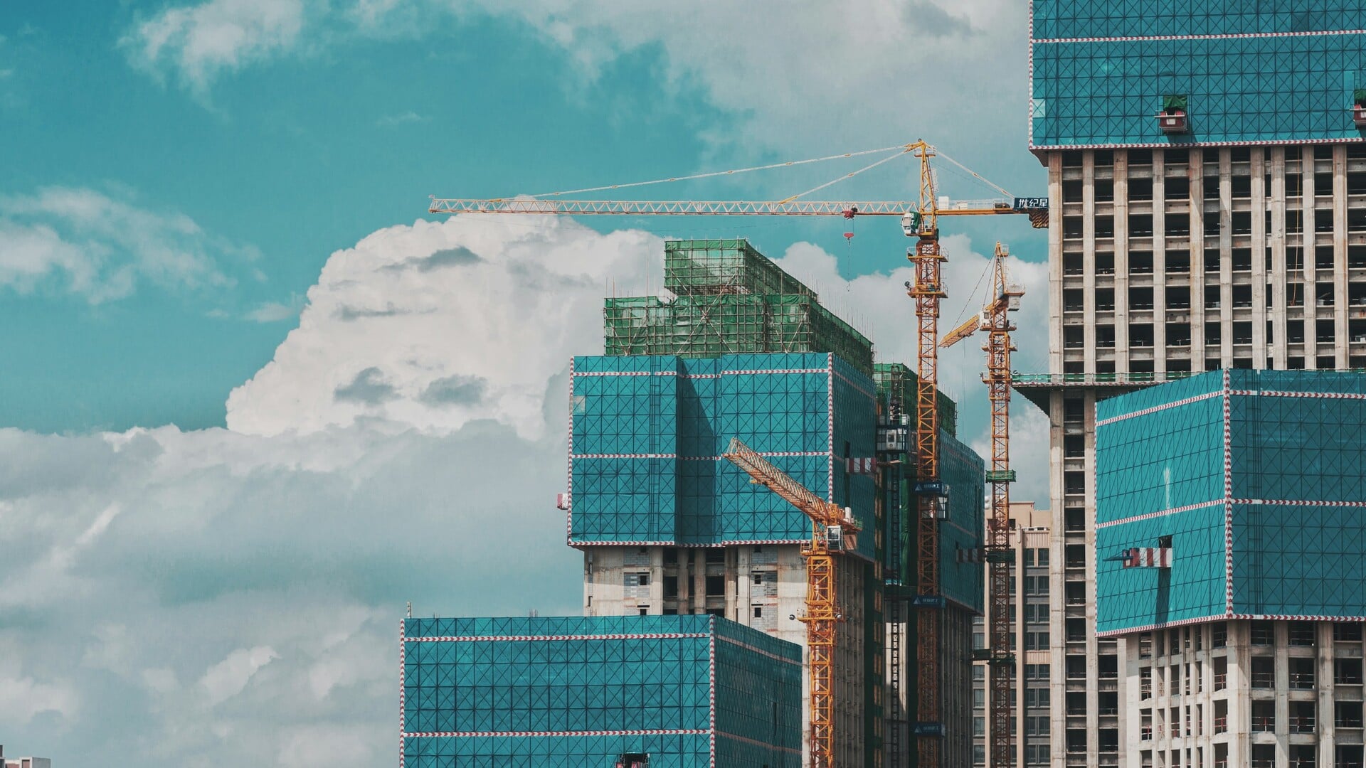 Wide aerial view of large construction site showing optimal camera placement positions