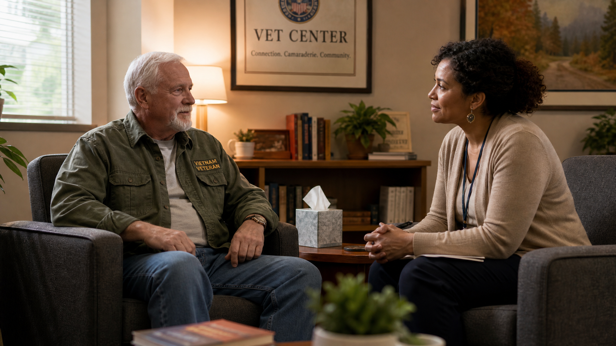 A senior White male veteran in a warm, private counseling session with a compassionate female Vet Center counselor