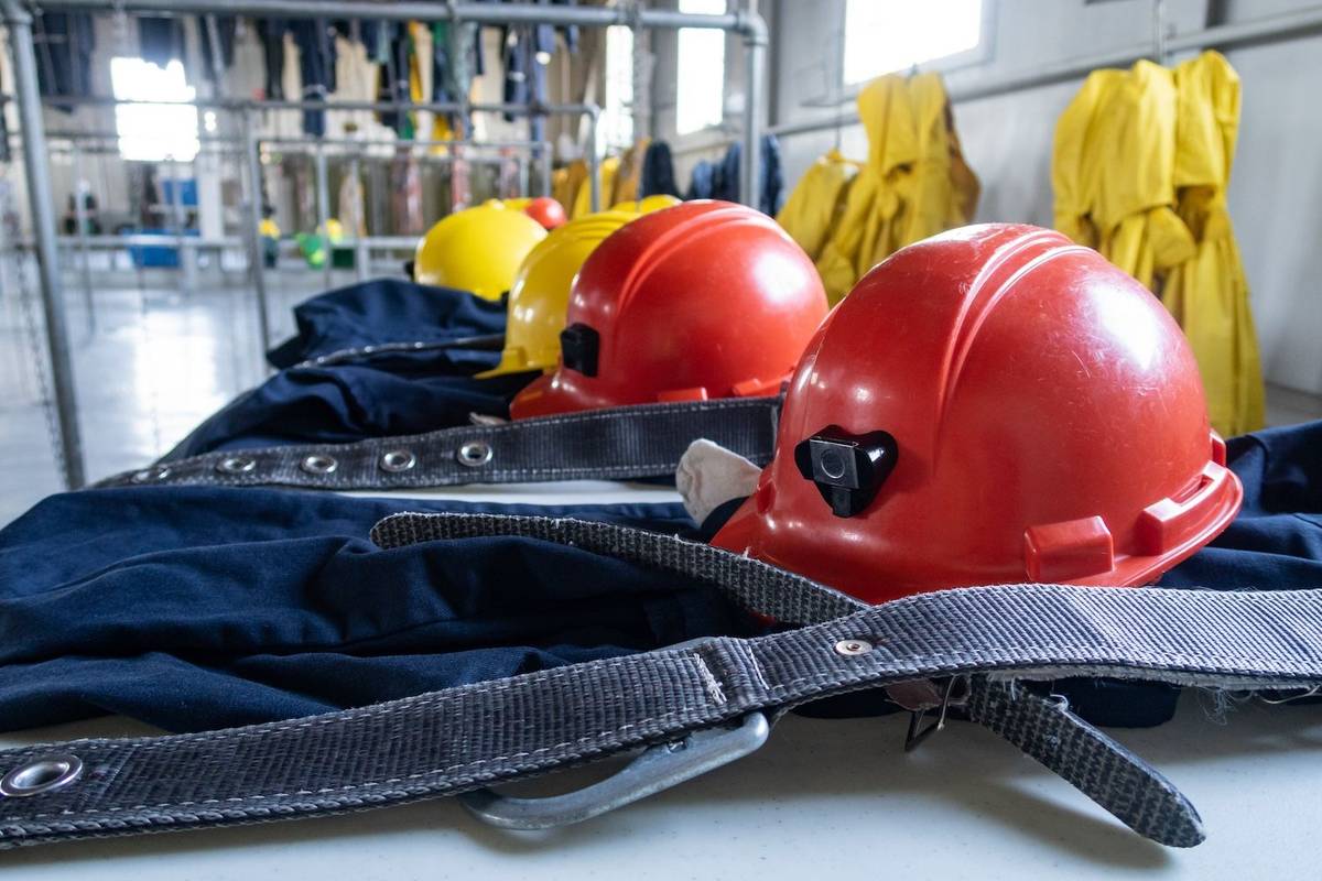 Mining professionals wearing safety equipment at a mining operation site