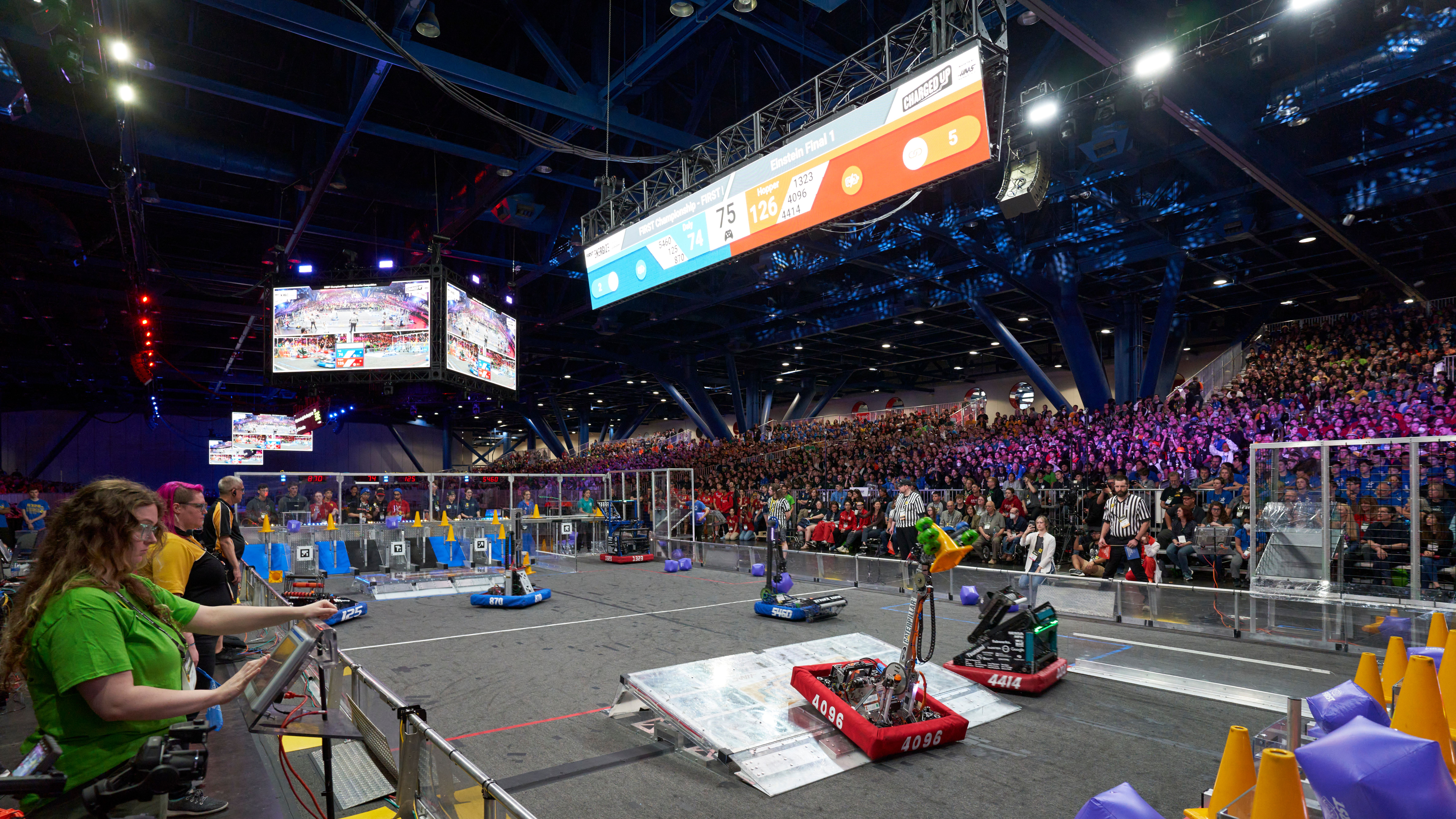 FIRST Tech Challenge robotics competition with students and robots