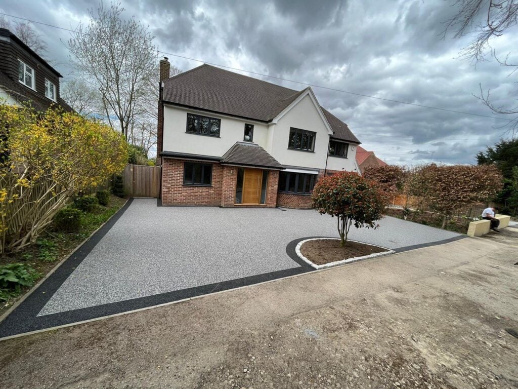 Modern tarmac driveway with block edging
