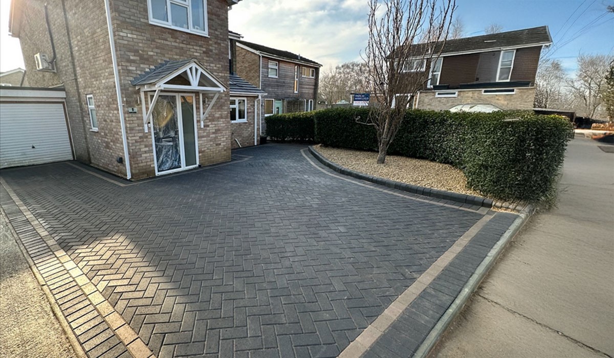 Block paving driveway with herringbone pattern