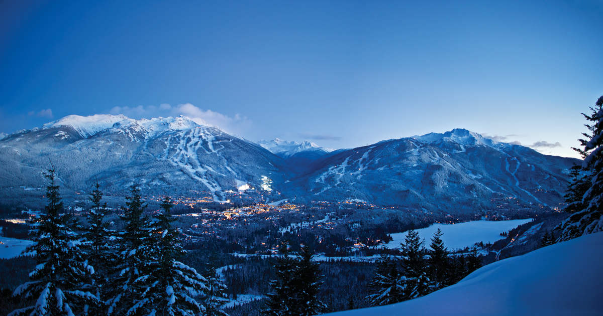 Snow-covered peaks of Whistler Blackcomb at dusk