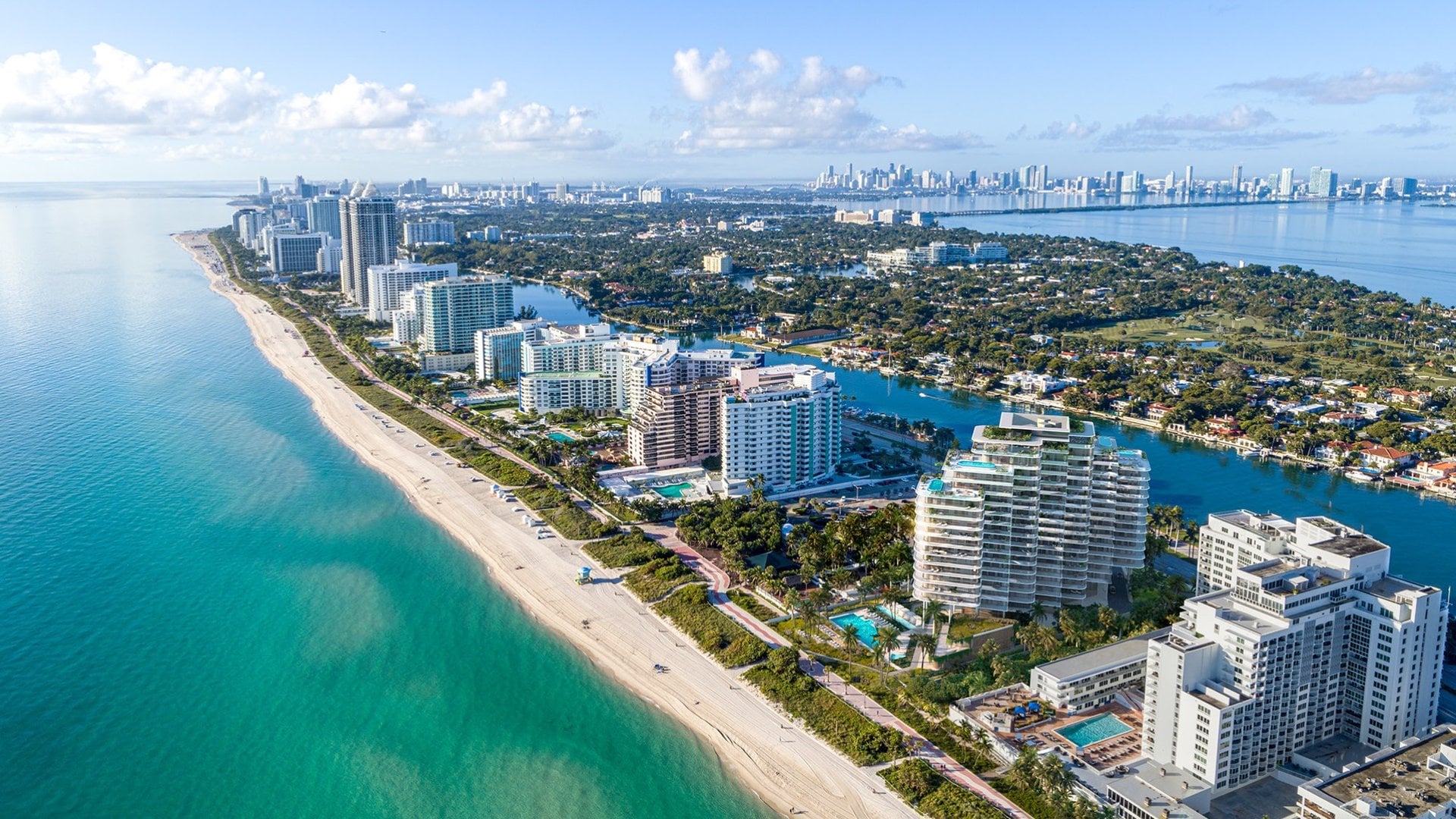 Aerial view of Miami Beach coastline with luxury high-rise condos
