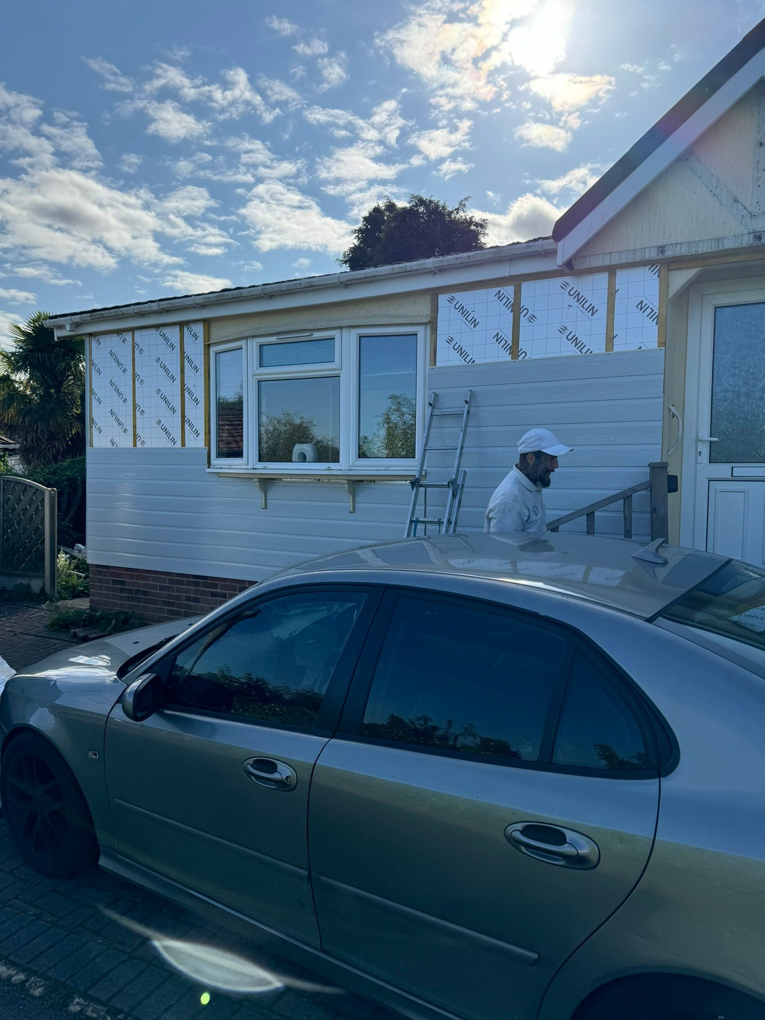 Park home cladding project showing completed horizontal boards on side elevation