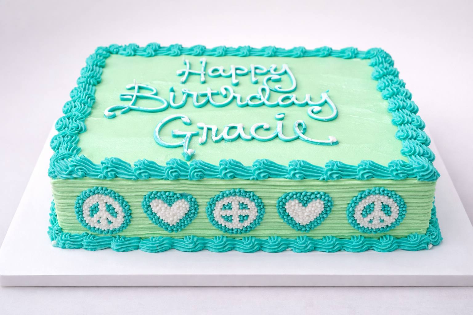 Teal peace and love birthday cake by Cleveland Cake Boss