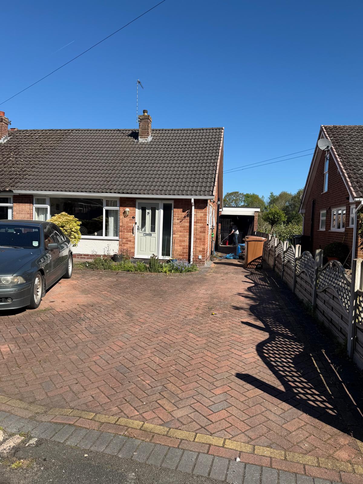 Patterned driveway after power washing - clean with colours brought back