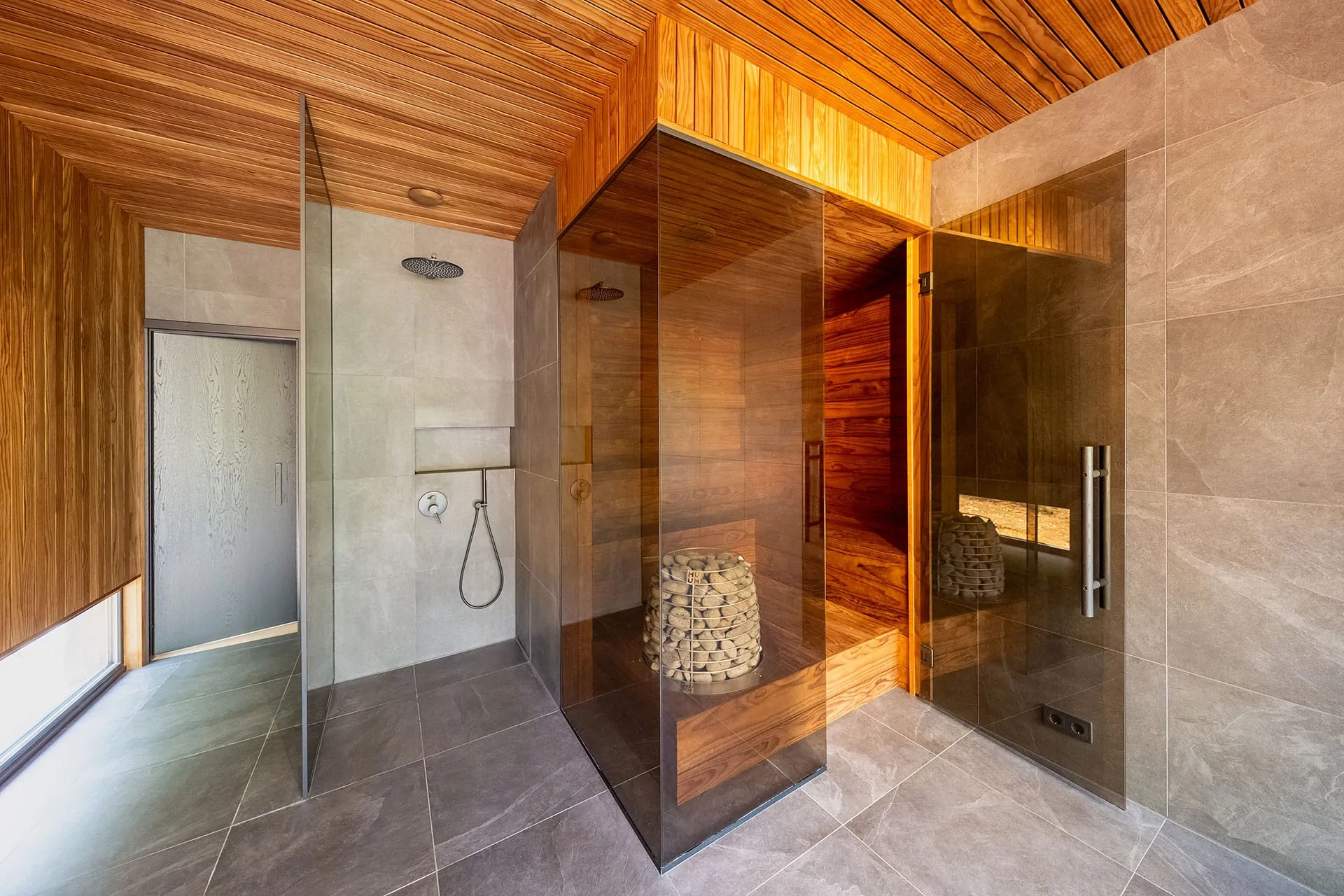 Luxury home sauna interior with warm cedar wood and ambient lighting