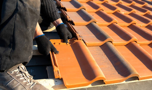Professional roofer at work on a UK property