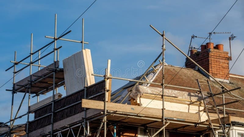 Scaffolding around UK house for major roofing work