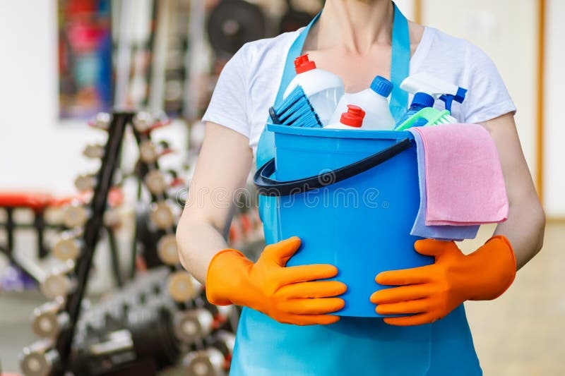 Professional cleaning staff with supplies
