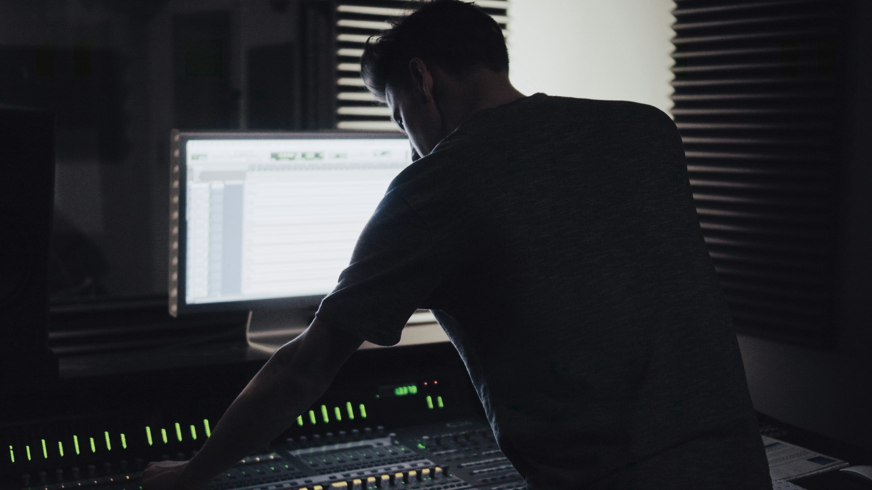 Music production studio with mixing console