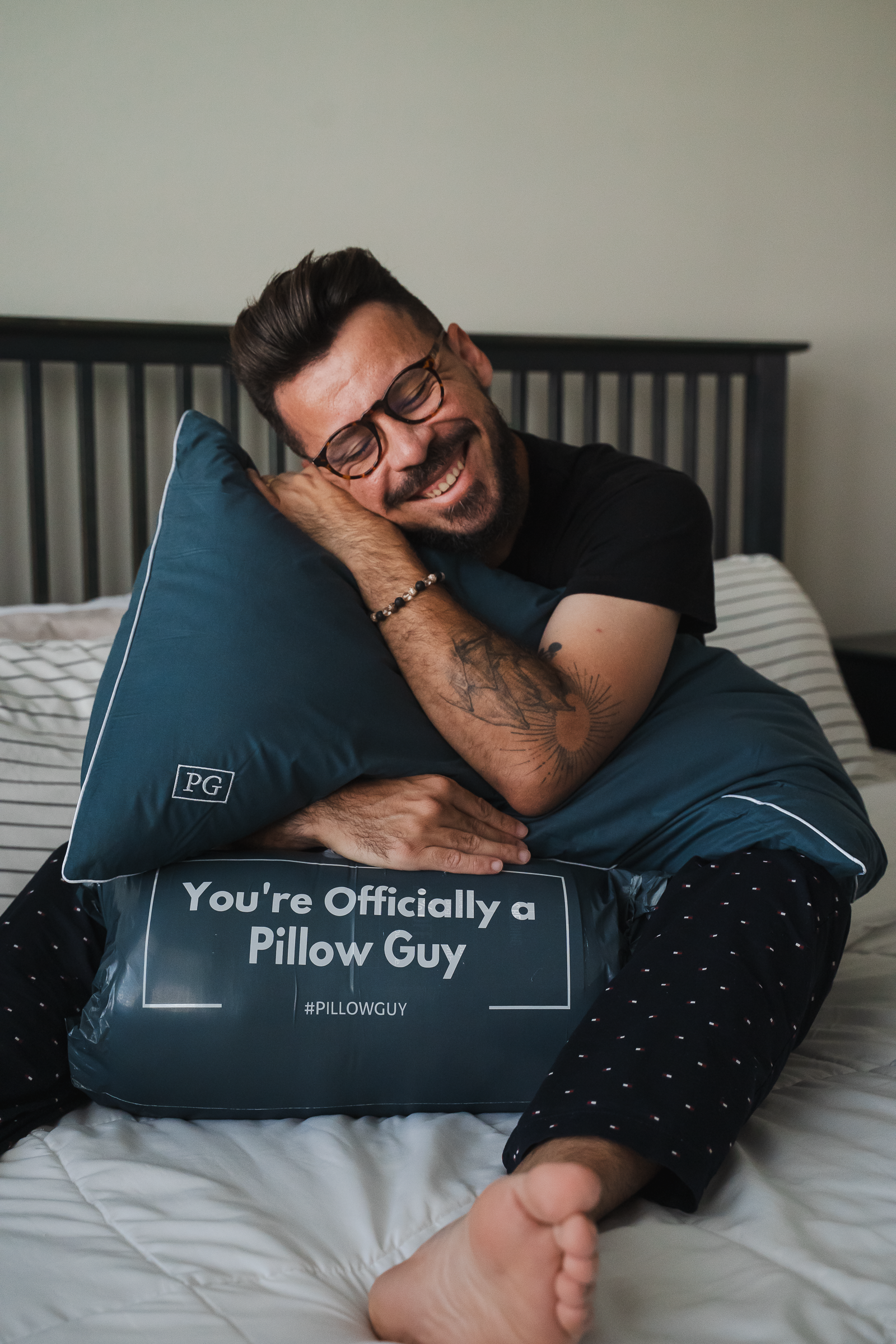 Man hugging Pillow Guy pillow smiling