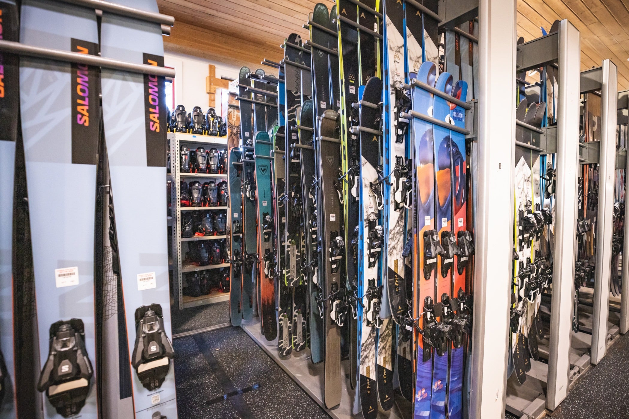 Ski rental shop with rows of equipment
