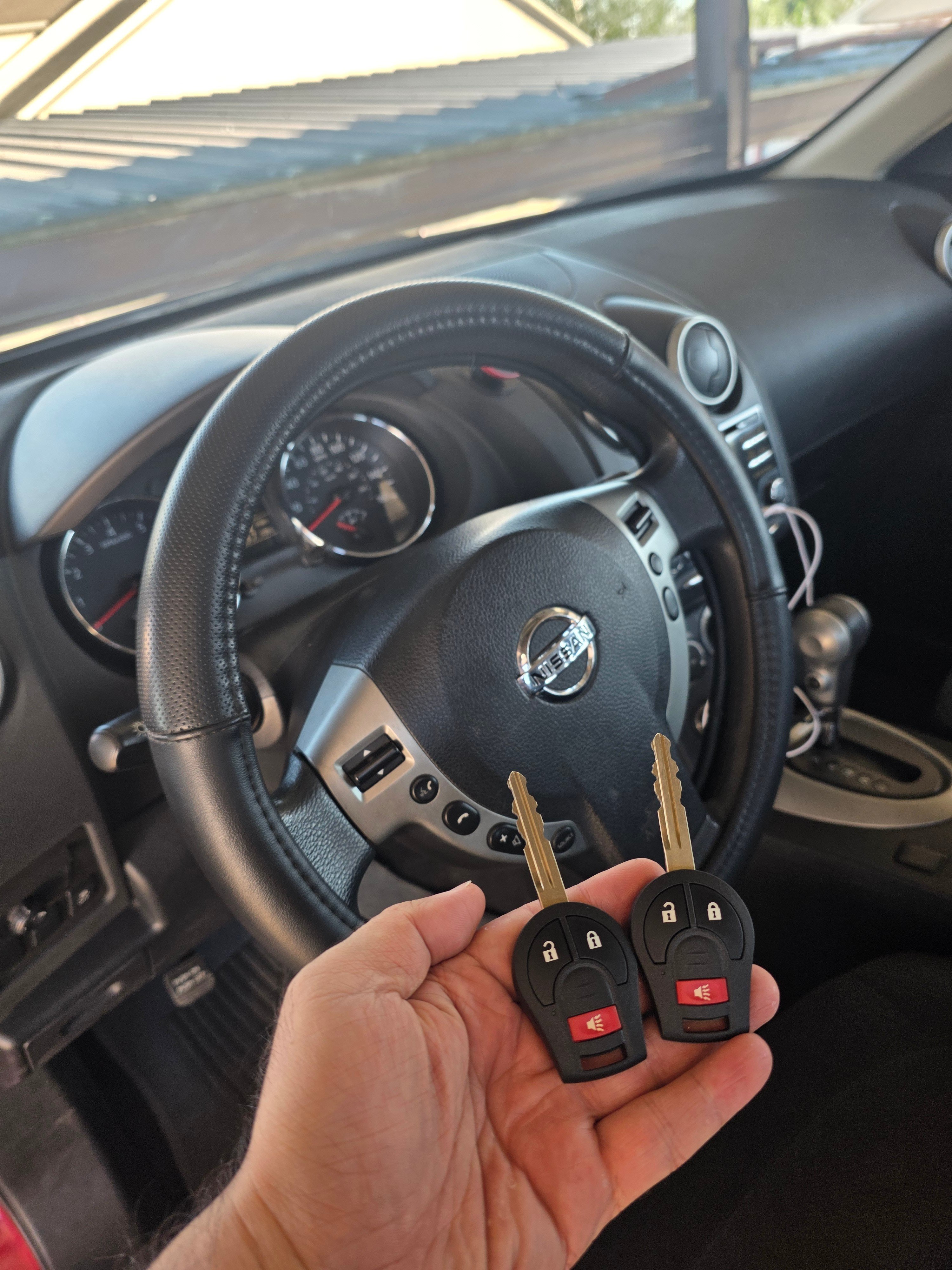 Two new Nissan remote keys made on-site by West Locksmith Katy