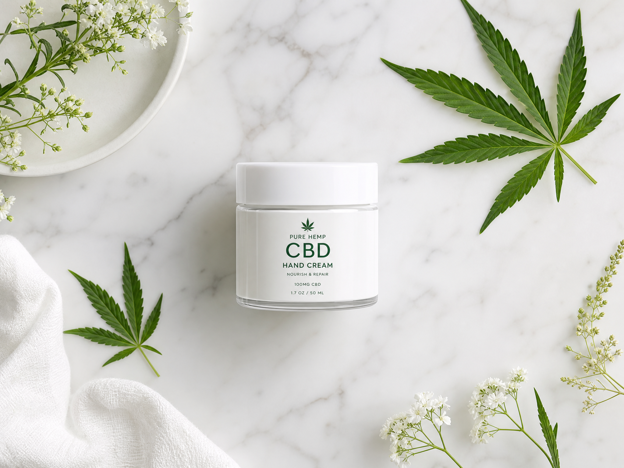 CBD hand cream jar with hemp leaves on marble surface - natural skincare flat lay