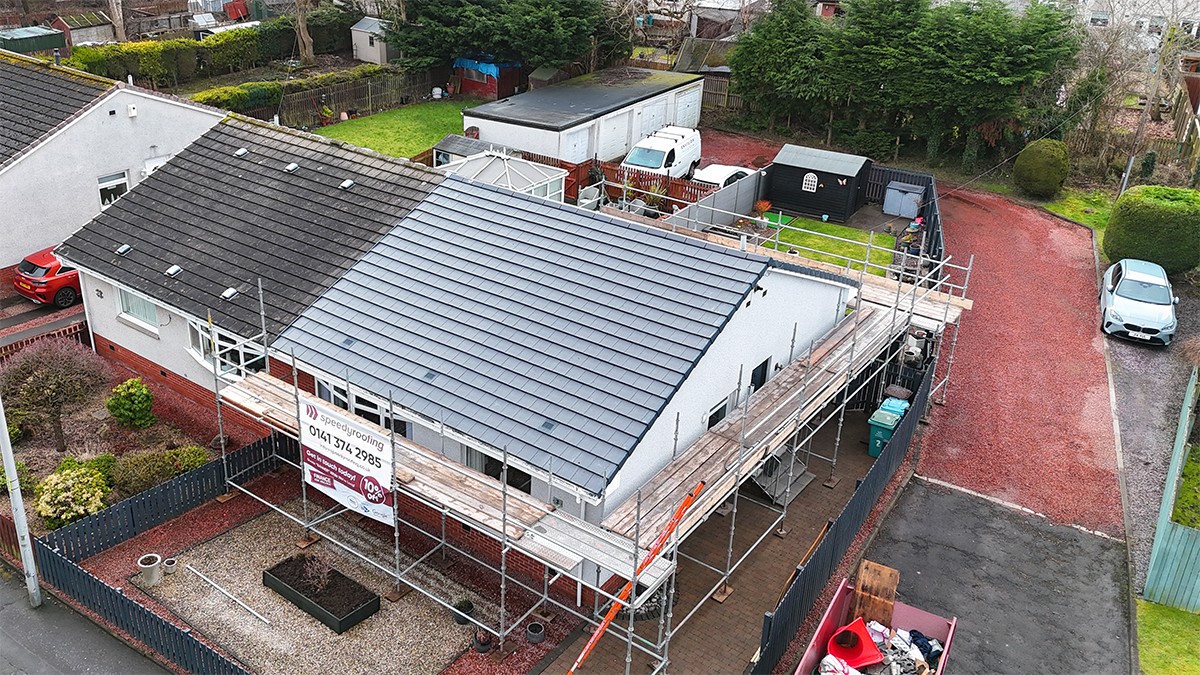 Completed roofing project with clean ridge line finish