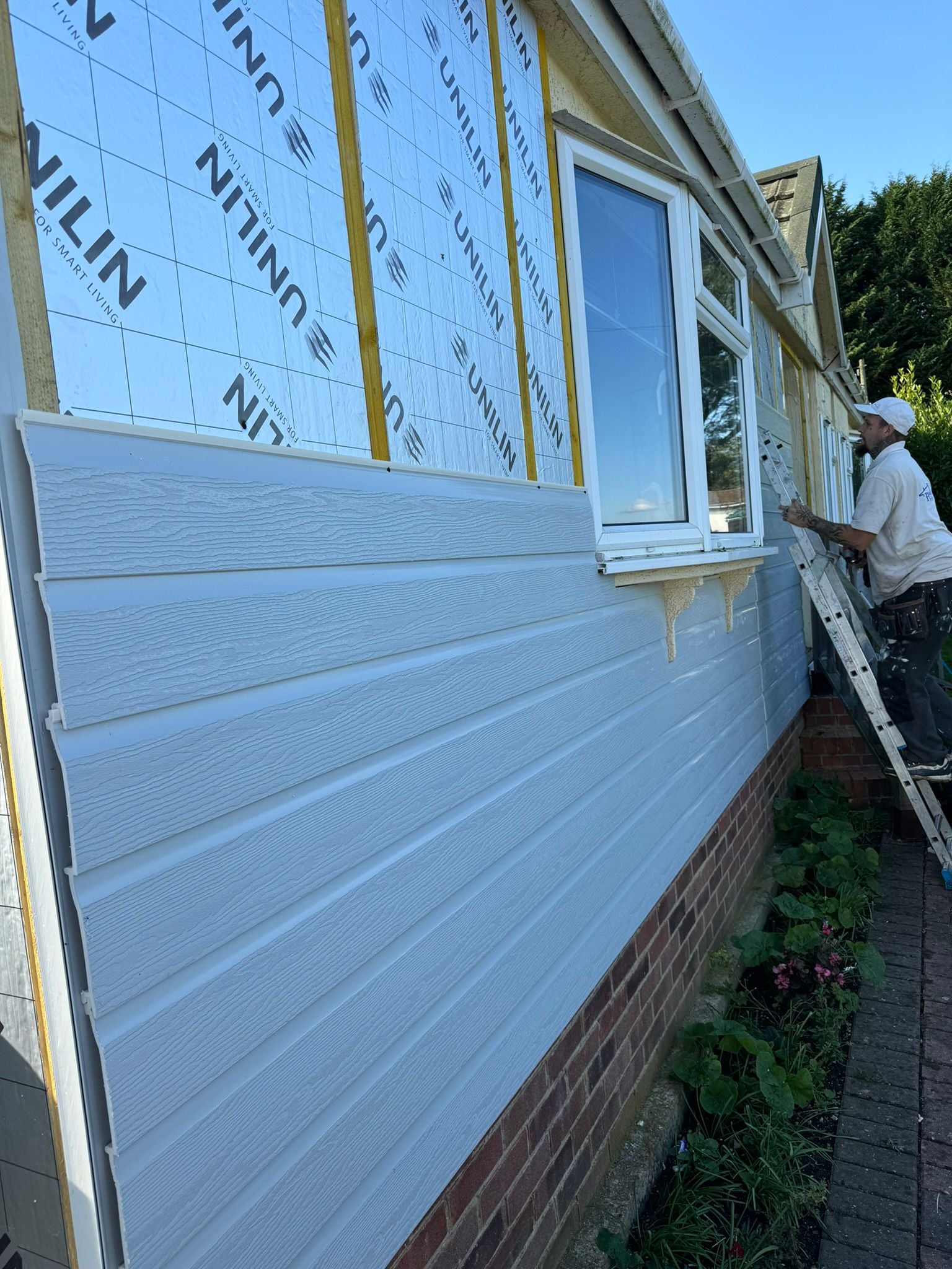 Finished cladding and window trim on park home side elevation