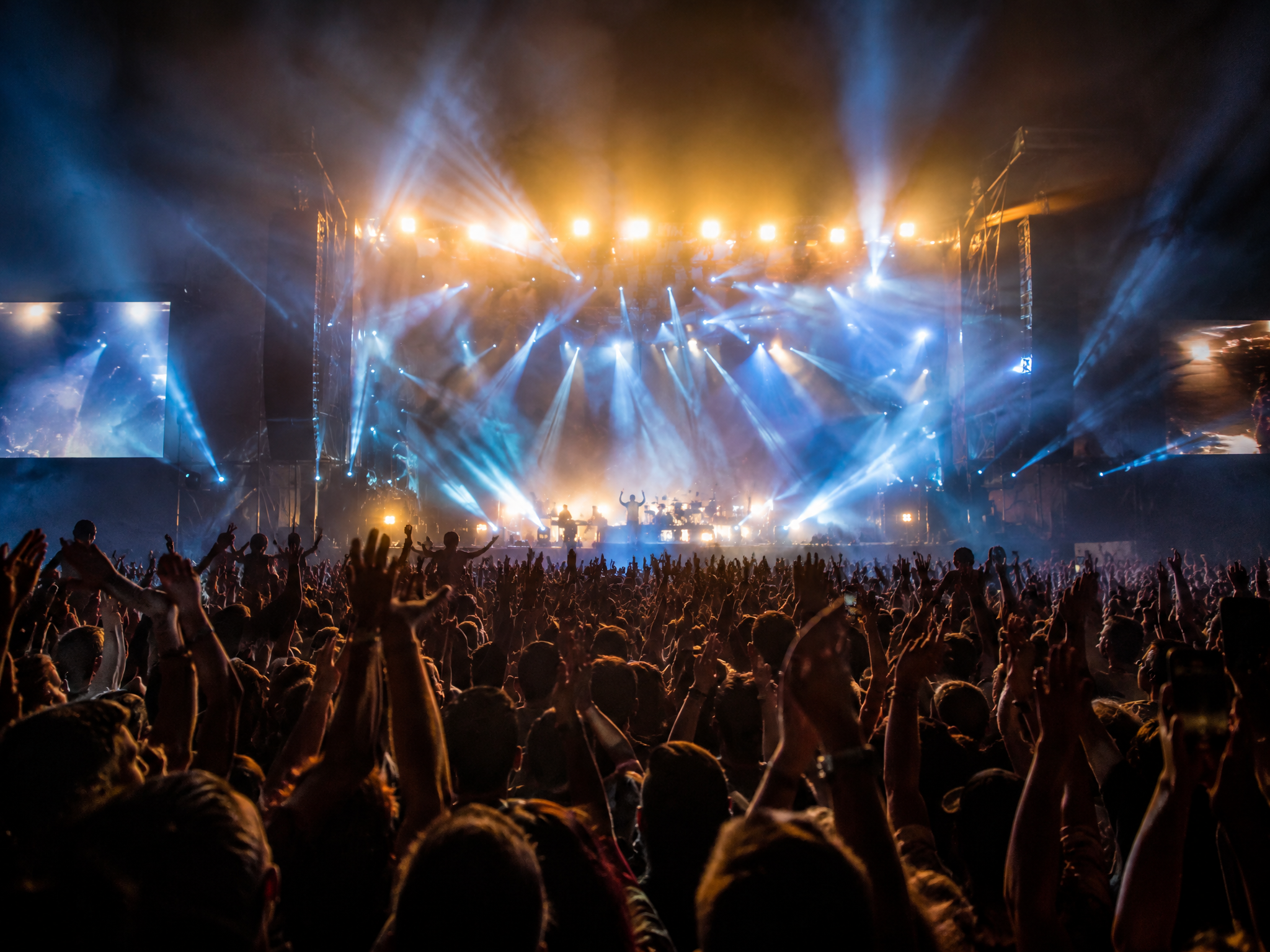 Concert crowd with dramatic lighting