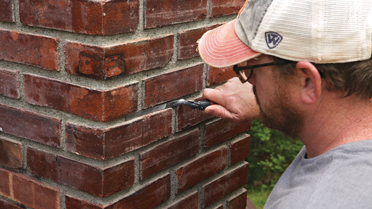 Chimney repointing mortar work close-up