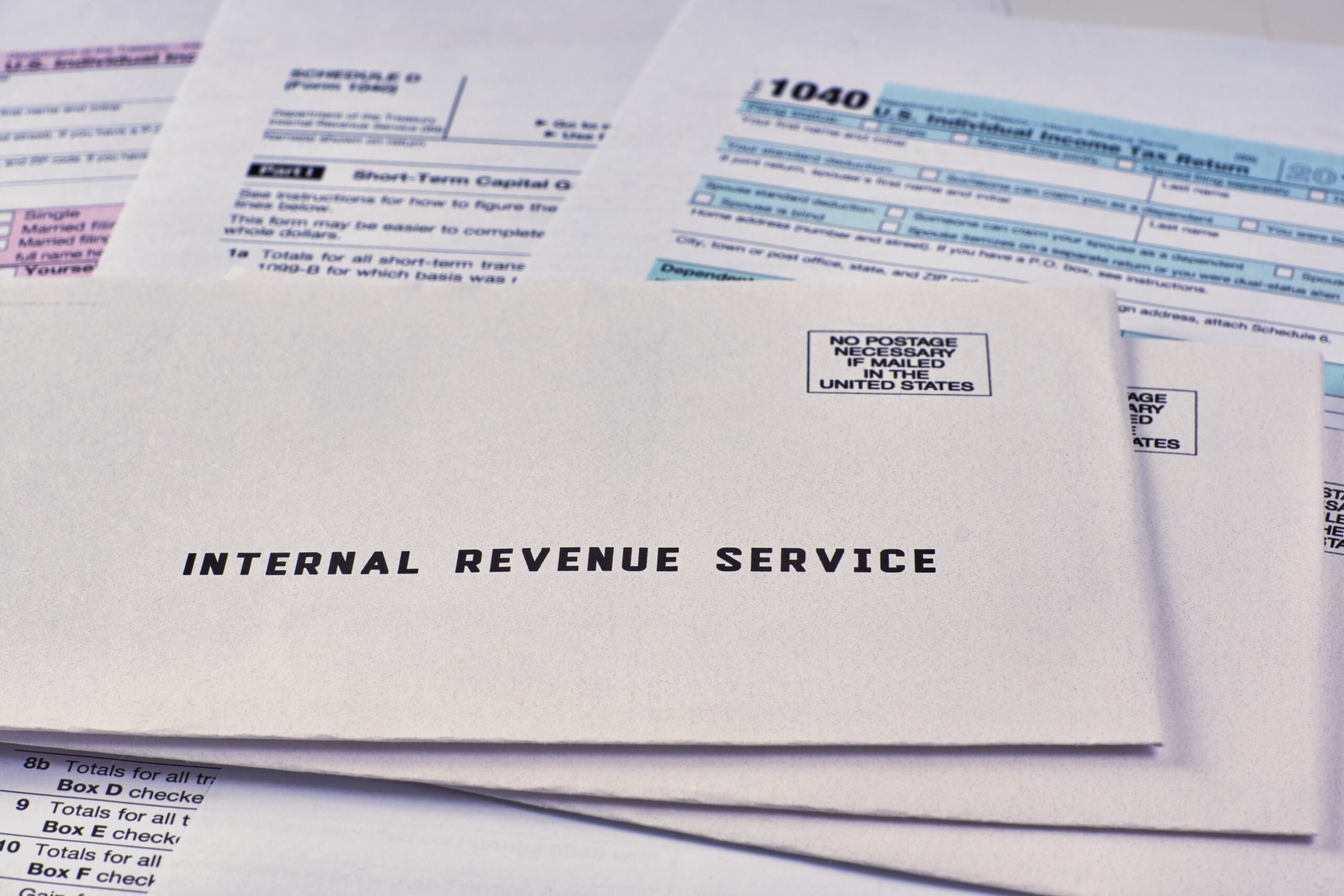 Professional reviewing IRS correspondence and tax documents