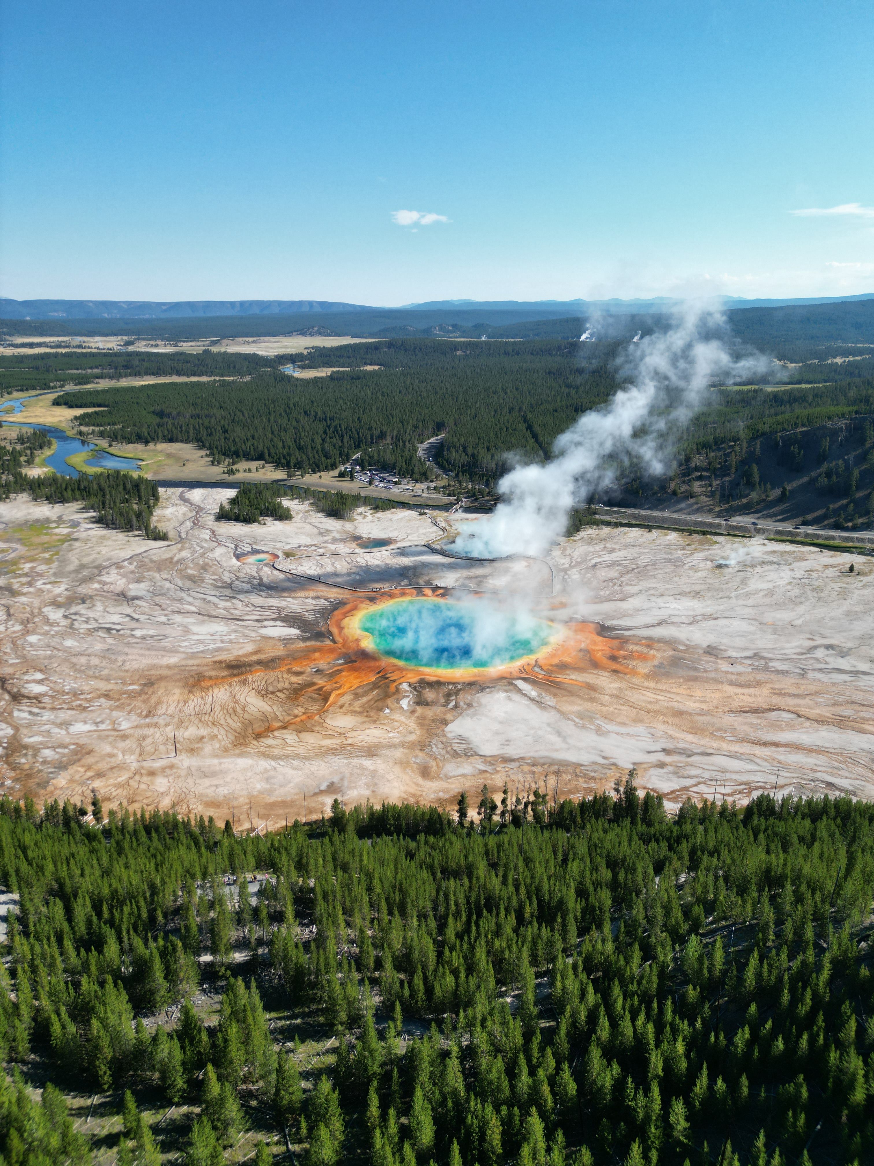 A vast volcanic caldera basin with geothermal features