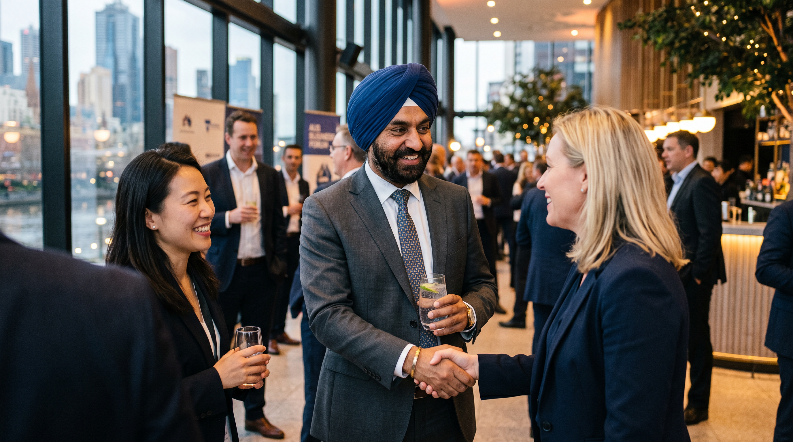 A Punjabi Sikh professional networking confidently at an Australian corporate event