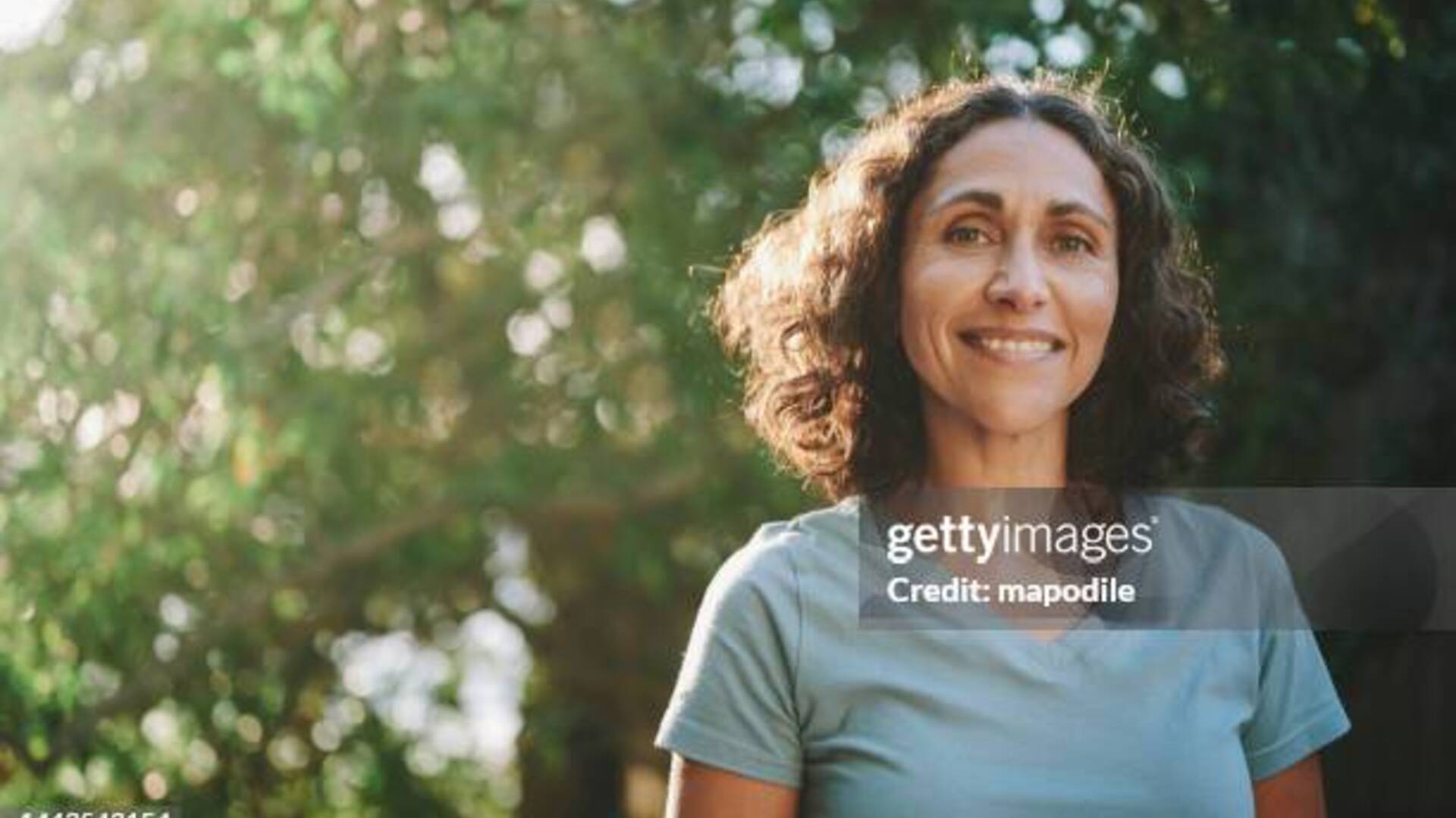 Woman in natural outdoor setting with soft lighting