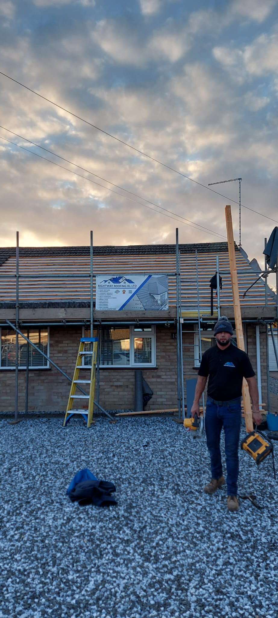 Professional roofing team working on new roof installation at sunset - Rightway Roofing Ltd