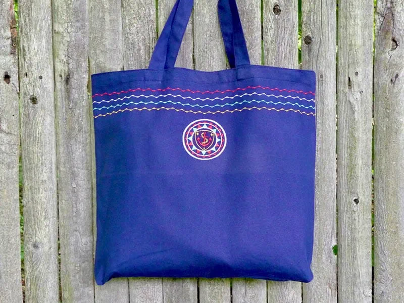 Close-up of embroidered logo stitching on custom canvas tote bag