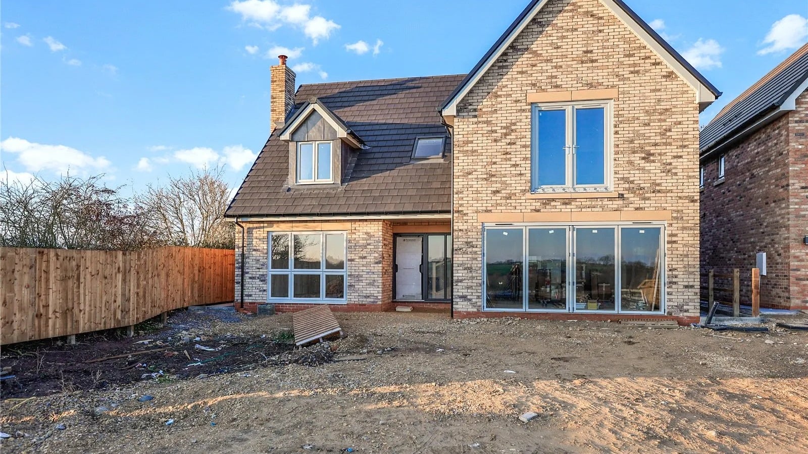 UK detached house with new slate roof