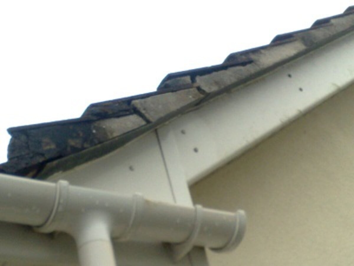 Crumbling mortar verge in need of dry verge replacement