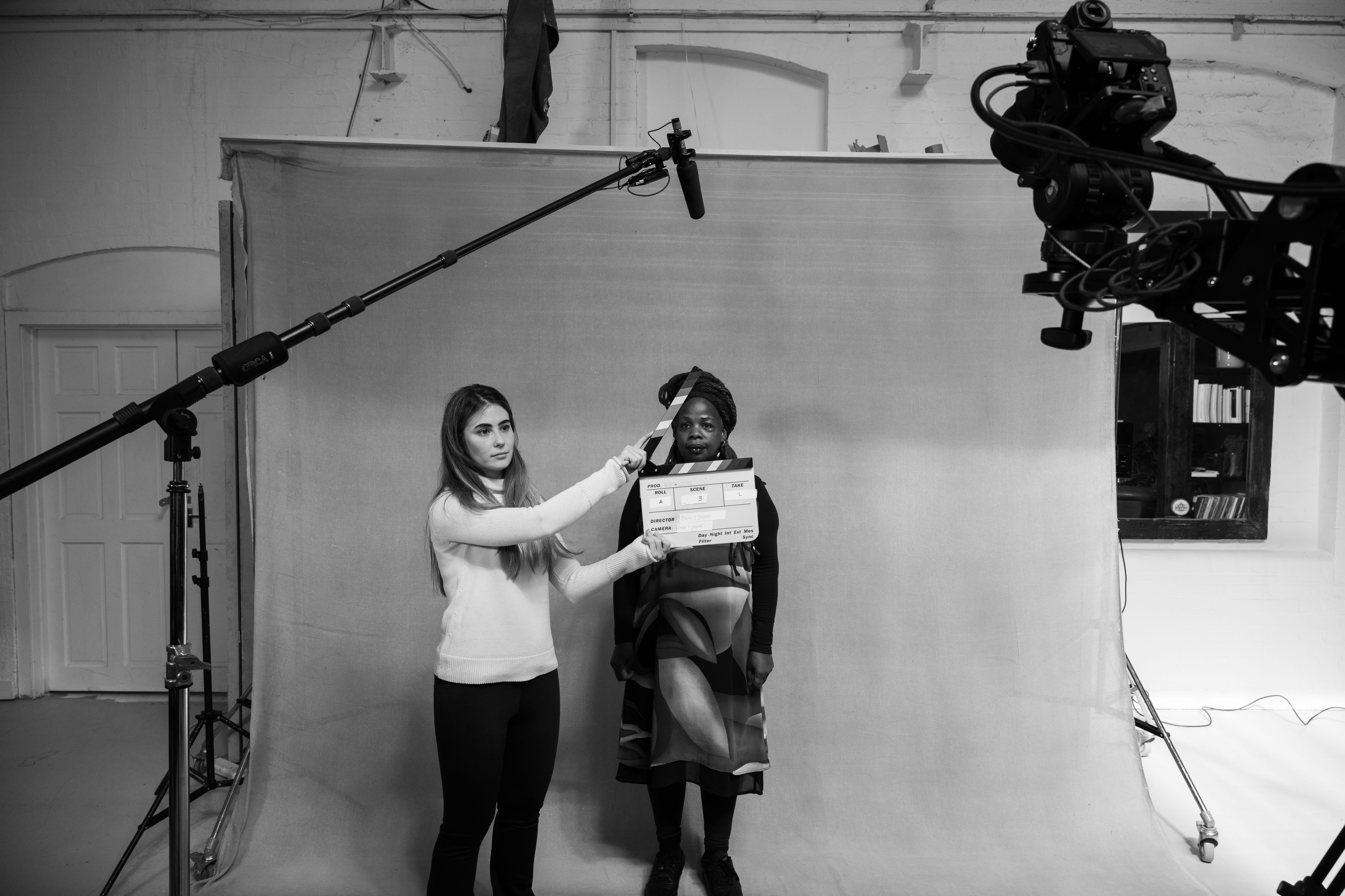 Behind the scenes: clapperboard marking a take on set