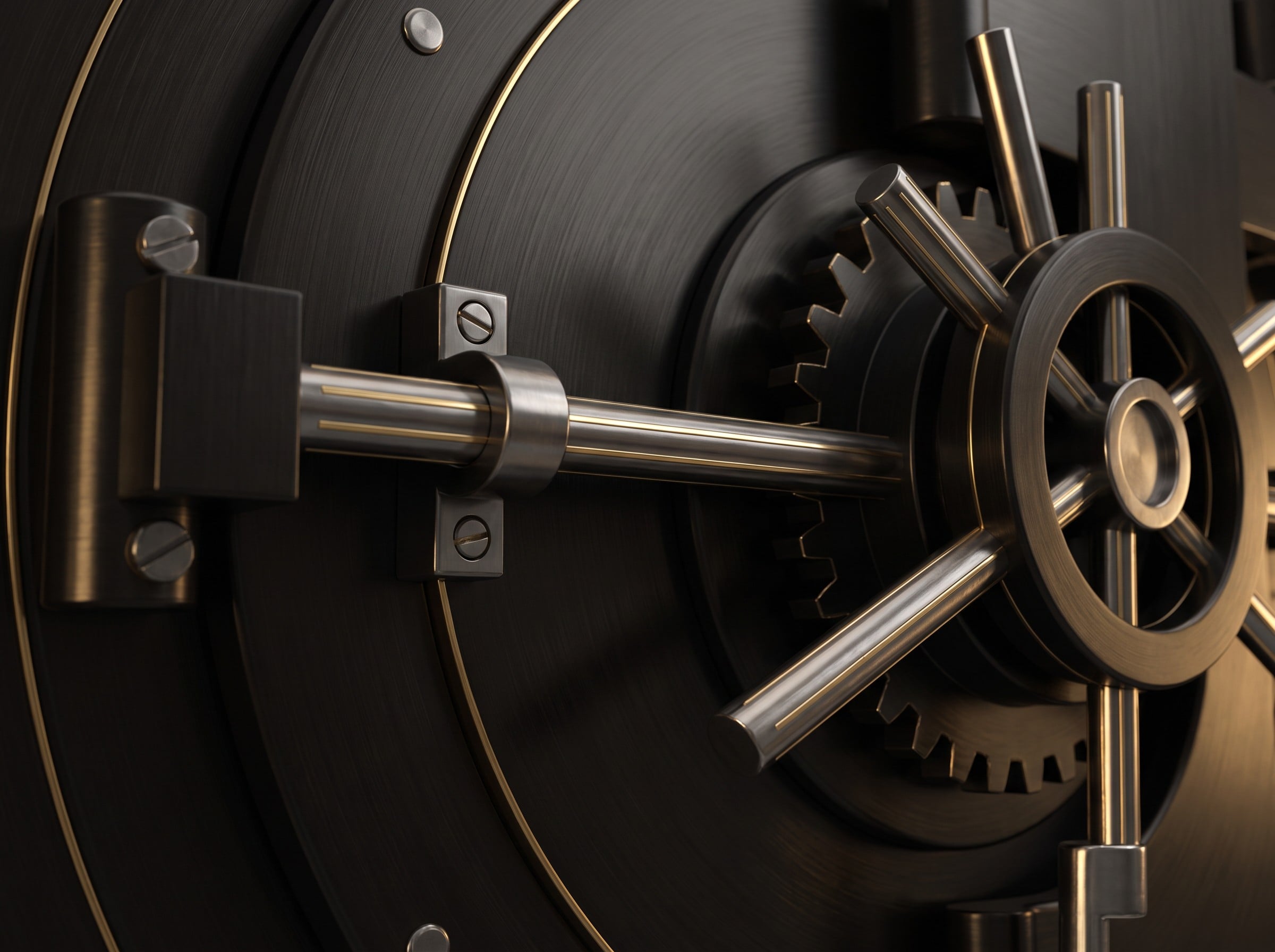 Close-up of a brushed black vault door with gold detailing
