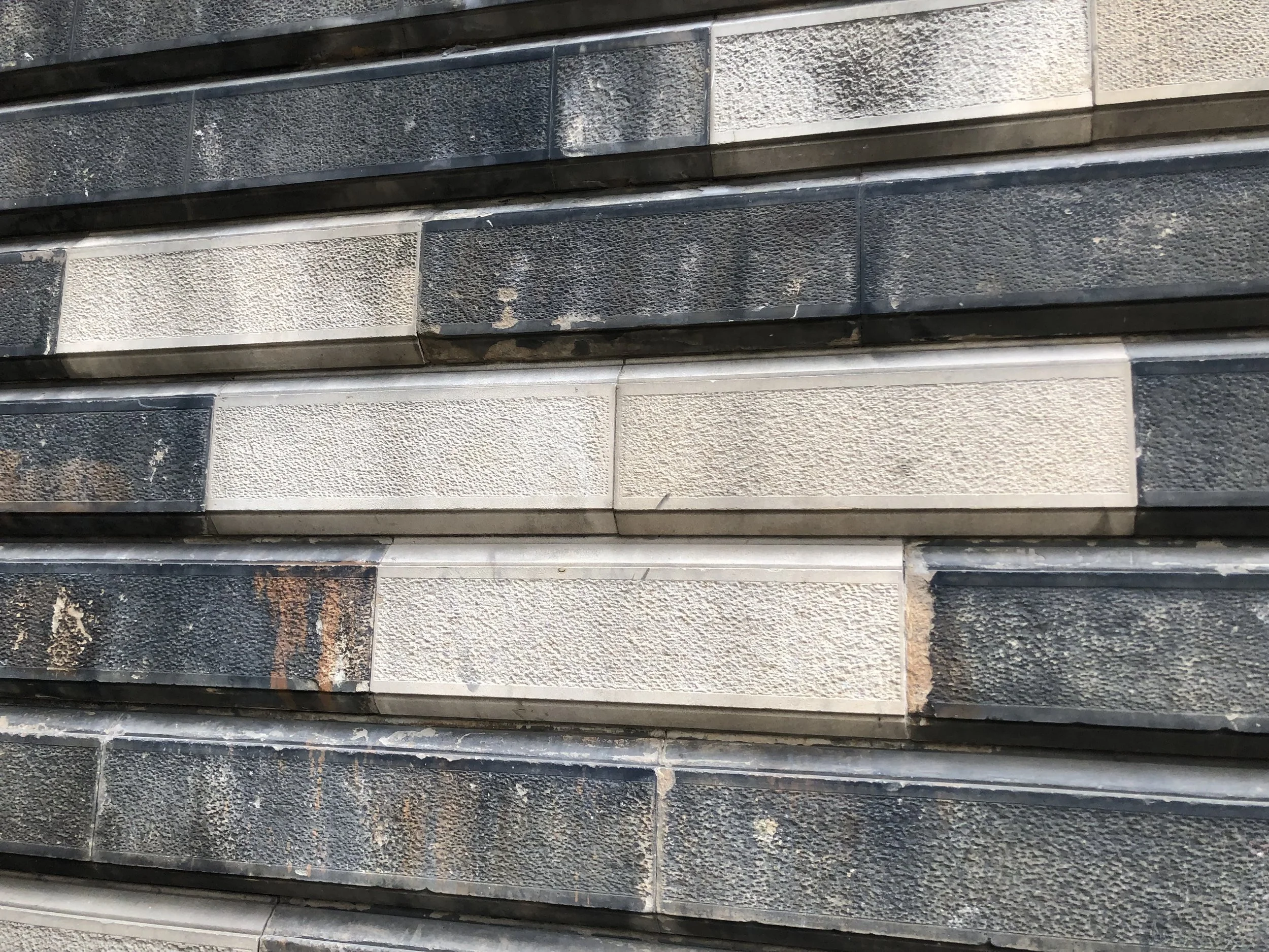 Weathered sandstone building before restoration
