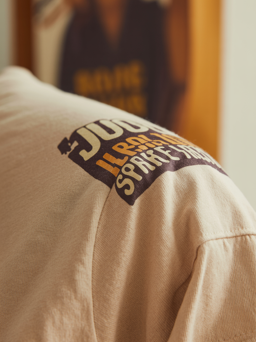 Close-up of premium cotton graphic t-shirt fabric showing soft texture and crisp print quality