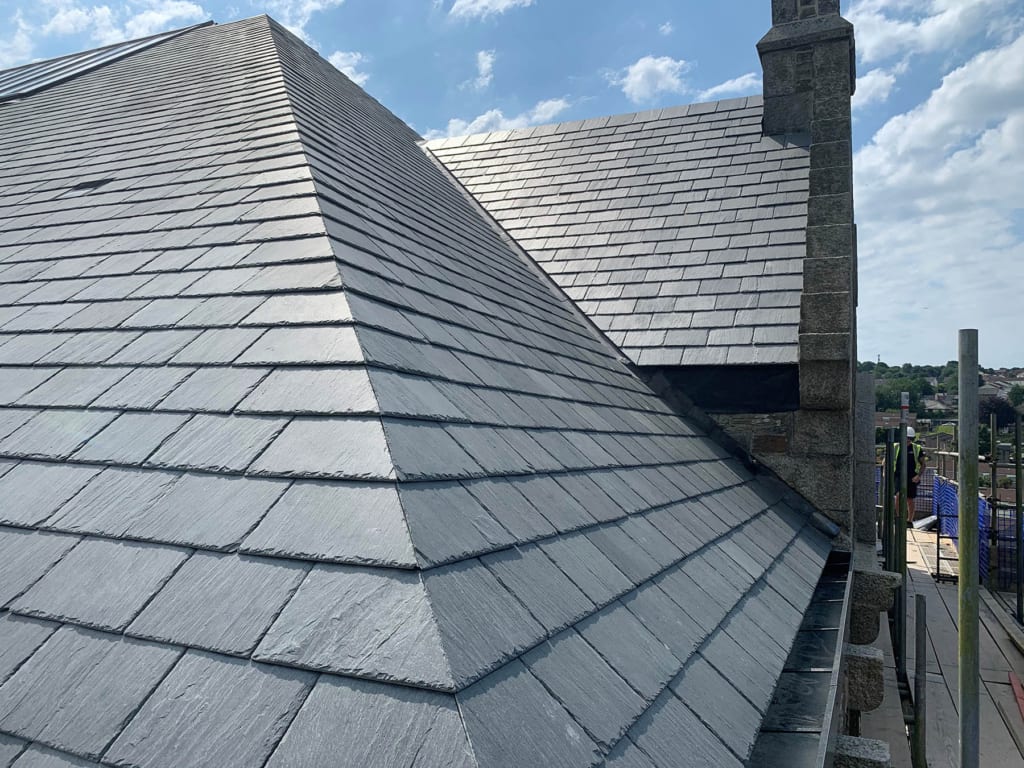 Professional slate roofing work on UK property