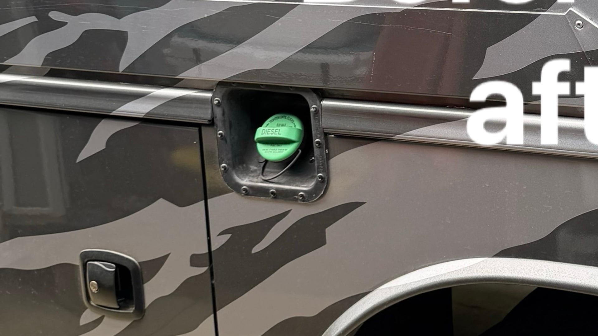 Exposed factory fuel cap on RV chassis — unprotected and vulnerable