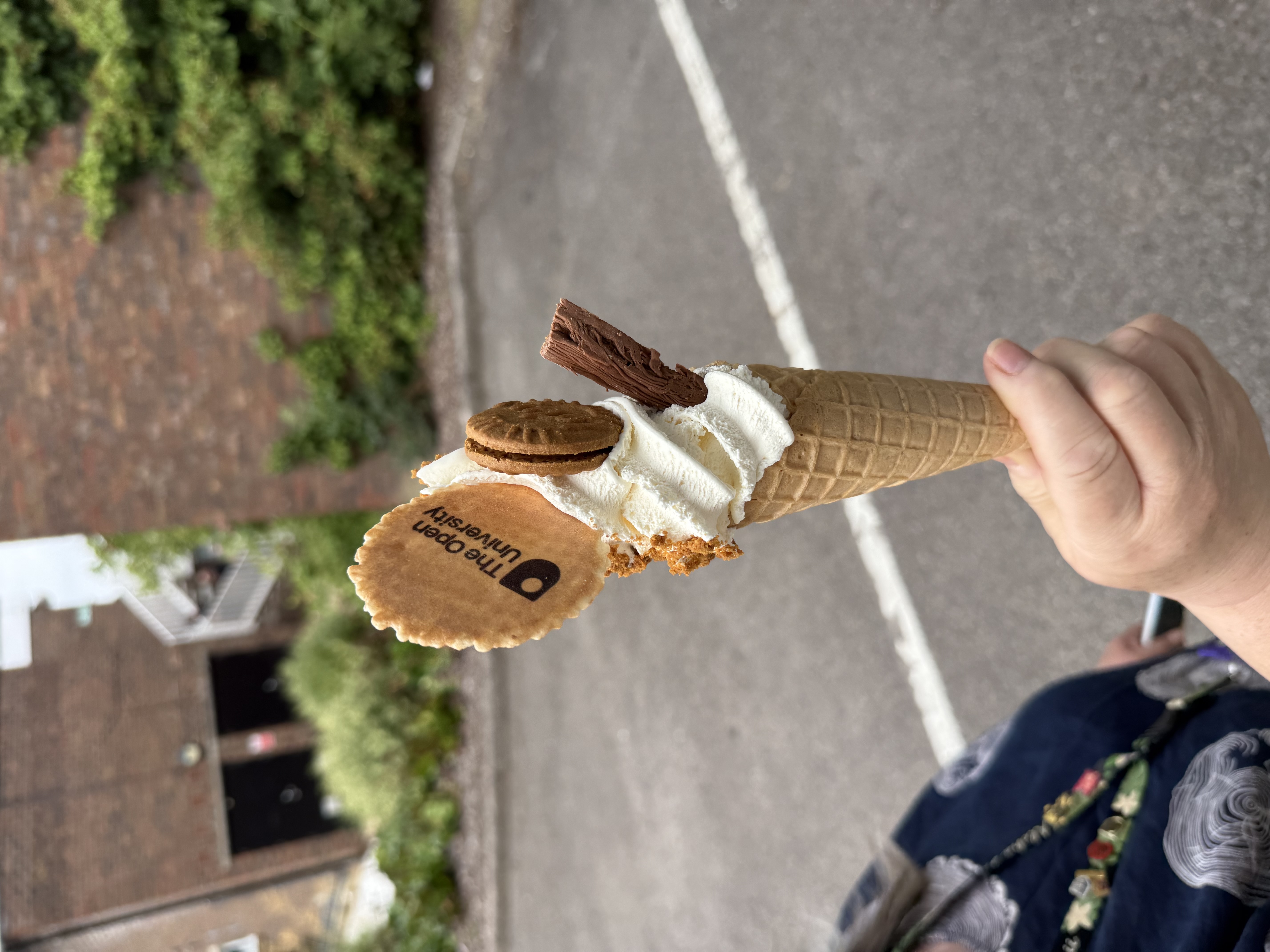 Branded soft serve ice cream with company logo wafer